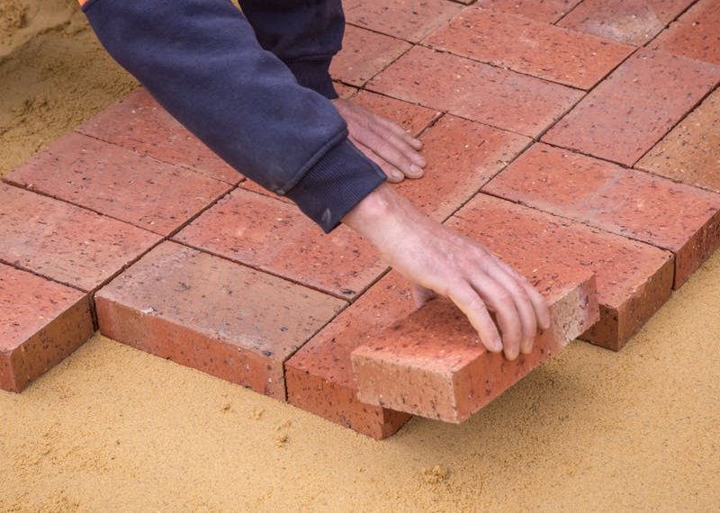 laying bricks on the ground